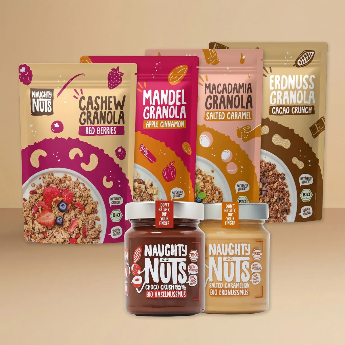 Granola Einsteiger Paket mit vier Granola-Beuteln und zwei Nussmus-Gläsern