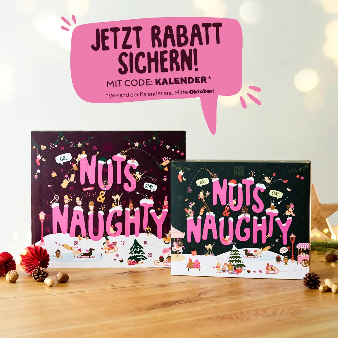Zwei Naughty Nuts Adventskalender auf einem Holztisch mit Rabattaktion