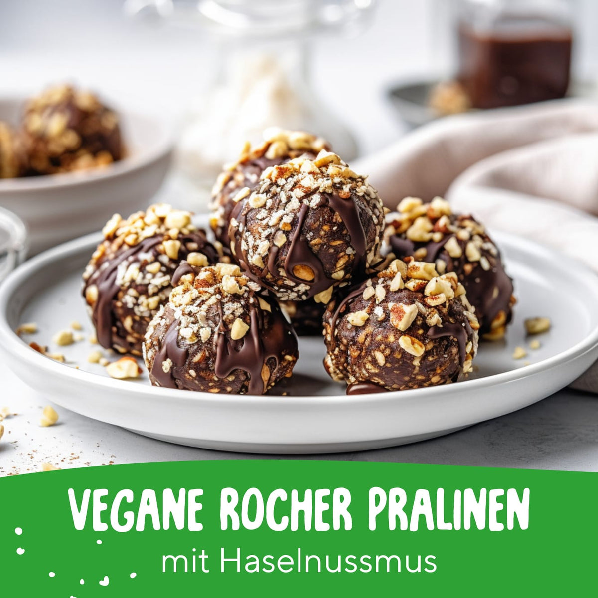 Vegane Rocher Pralinen mit Haselnussmus und Schokoladenüberzug auf einem weißen Teller